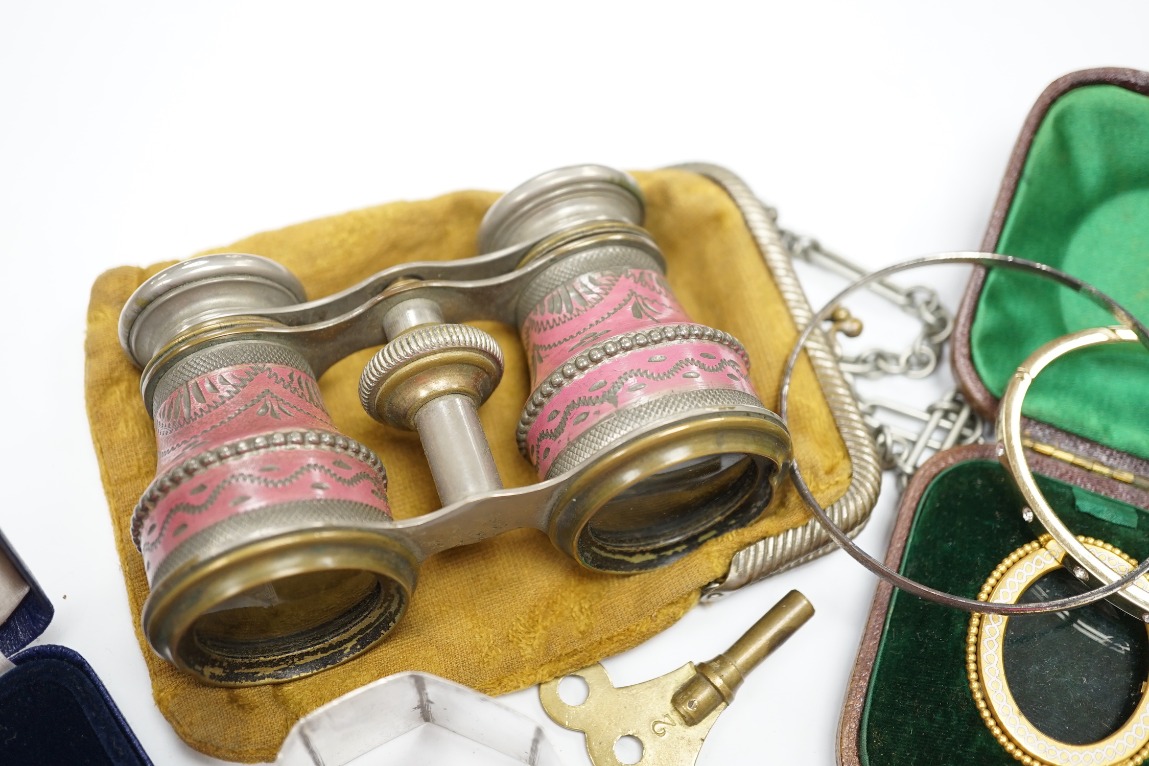 A small group of jewellery, silver and other collectables including a modern silver meat skewer, 20.6cm, silver napkin rings, Swiss 935 white metal pocket watch, unmounted cut stones, pen, opera glasses etc.